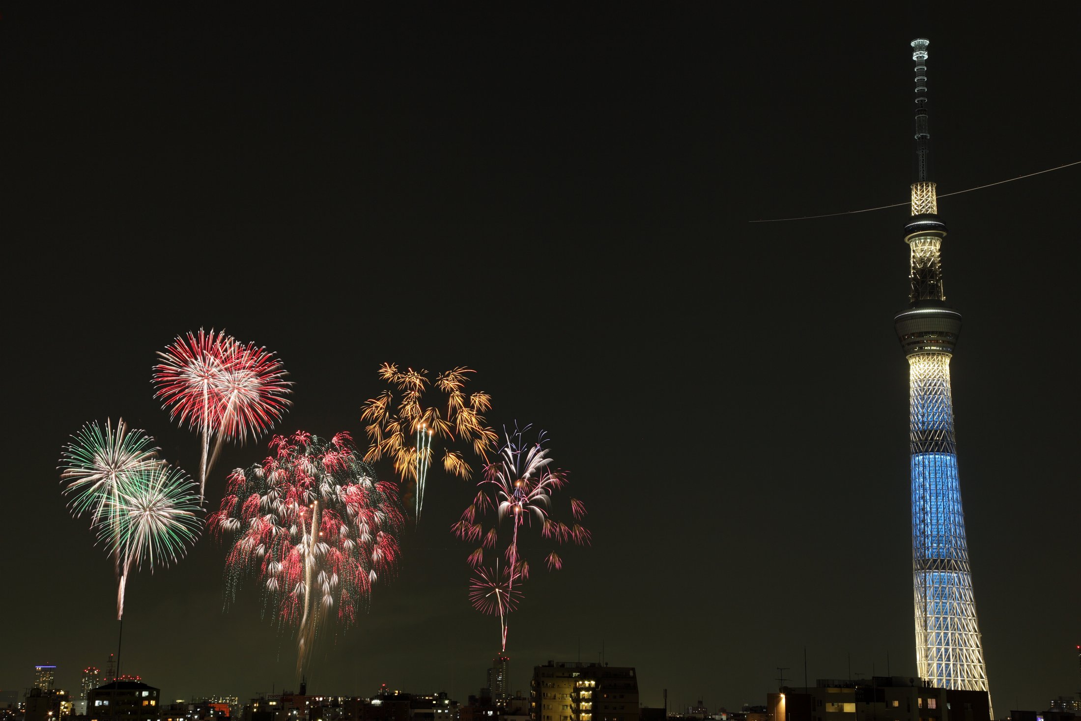Fireworks over Tokyo Skytree during a summer festival