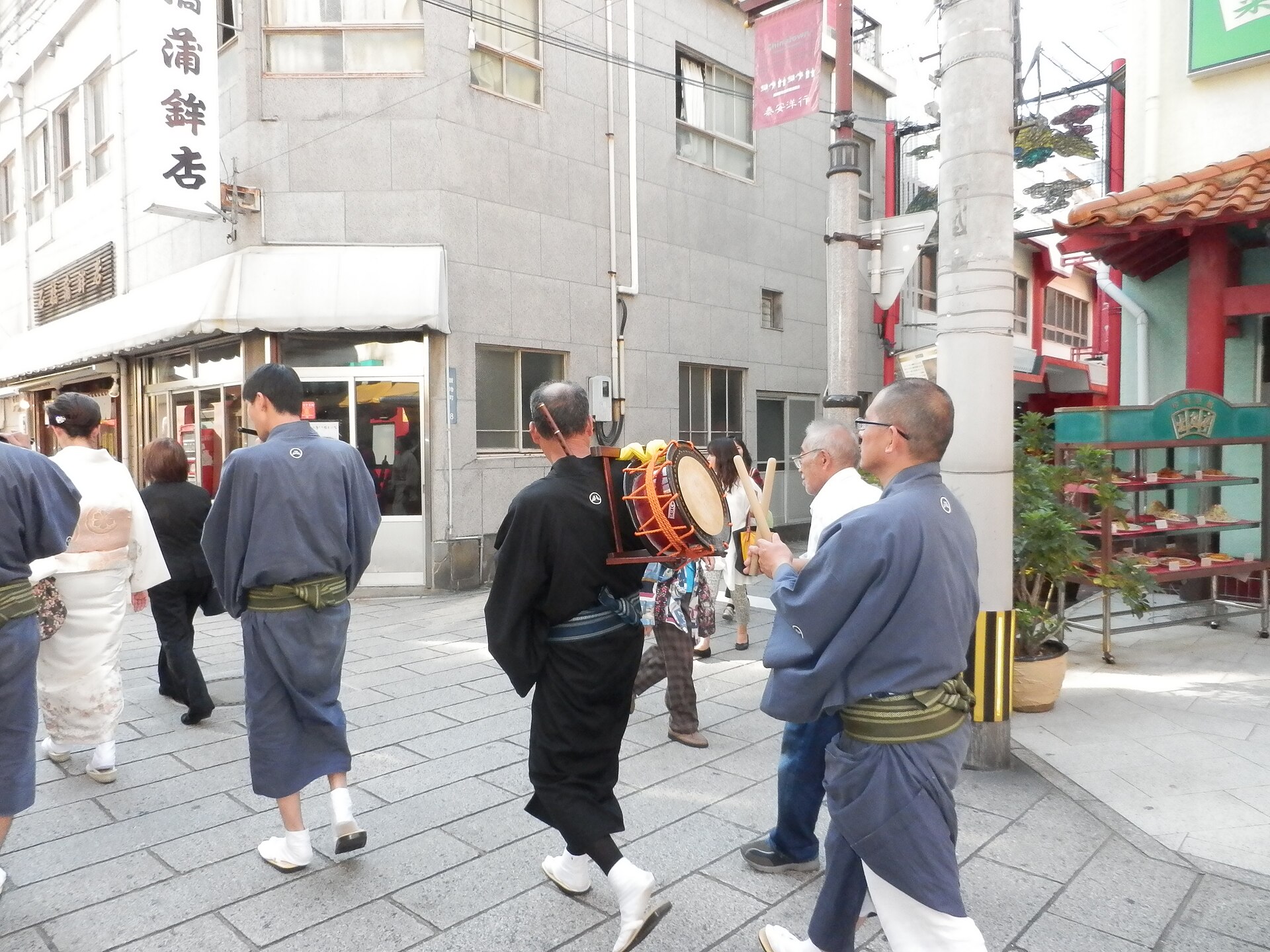 Festival musicians walking through Nagasaki during Kunchi
