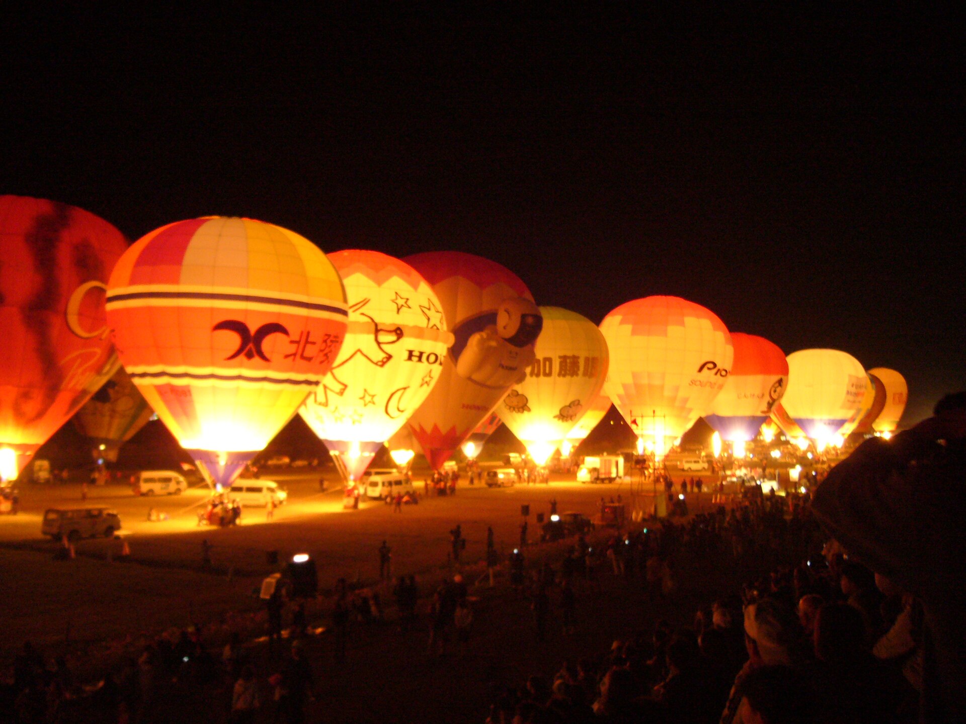 Hot-air balloons illuminated at night at the Saga Balloon Fiesta