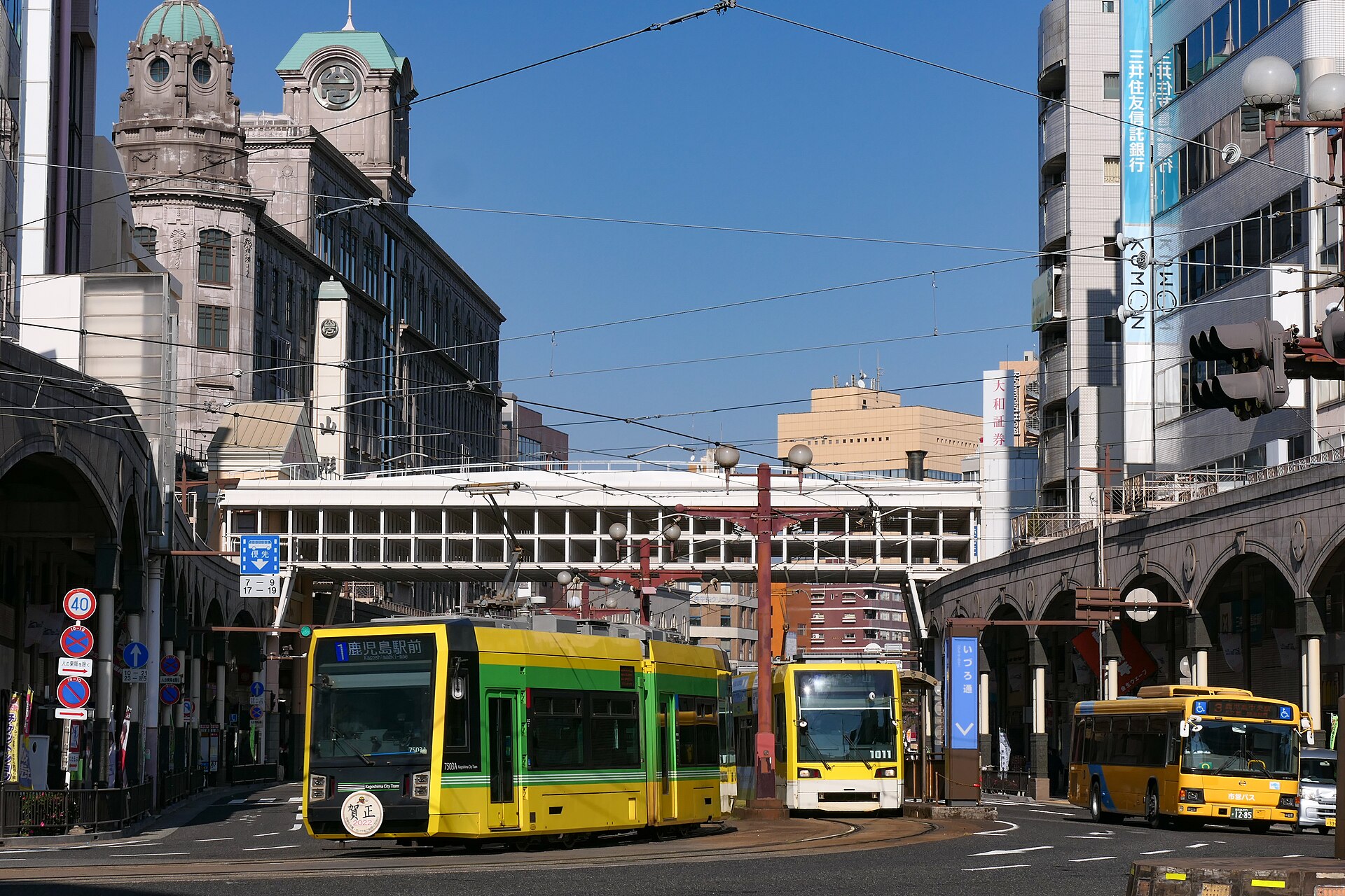Kagoshima city tram and bus on a central street