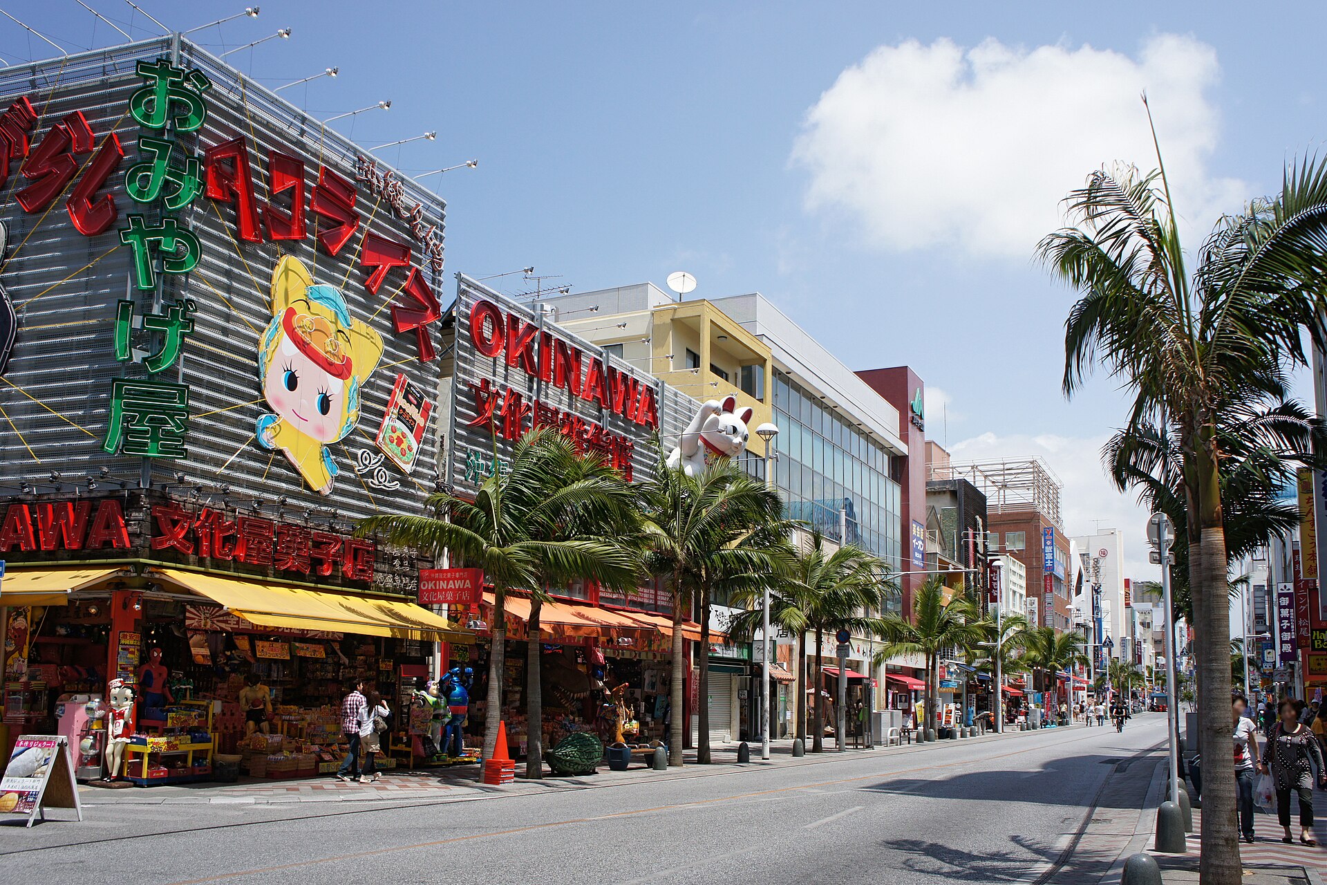 Shops and palms on Kokusai Street in Naha