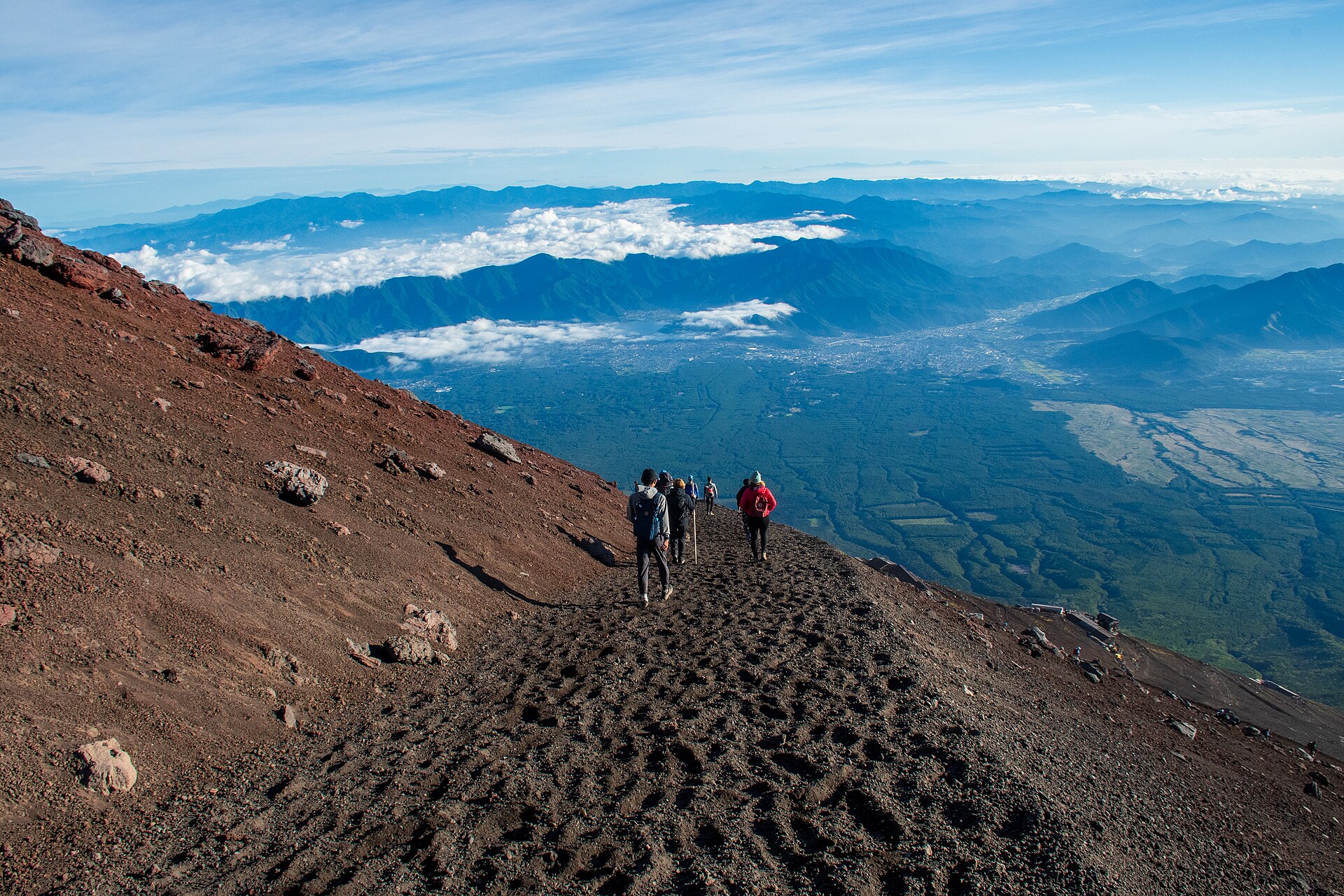 Hikers descending Mount Fuji on the Yoshida Trail